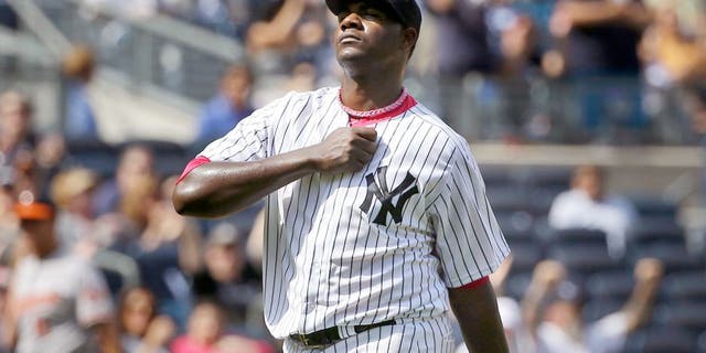 New York Yankees starting pitcher Michael Pineda reacts after striking out Baltimore Orioles' Ryan Flaherty during the seventh inning of the baseball game at Yankee Stadium, Sunday, May 10, 2015, in New York. (AP Photo/Seth Wenig)