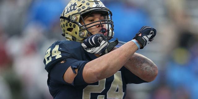 FORT WORTH, TX - JANUARY 02: James Conner #24 of the Pittsburgh Panthers celebrates after scoring a touchdown during the Lockheed Martin Armed Forces Bowl game against the Houston Cougars at Amon G. Carter Stadium on January 2, 2015 in Fort Worth, Texas. (Photo by Sarah Glenn/Getty Images)