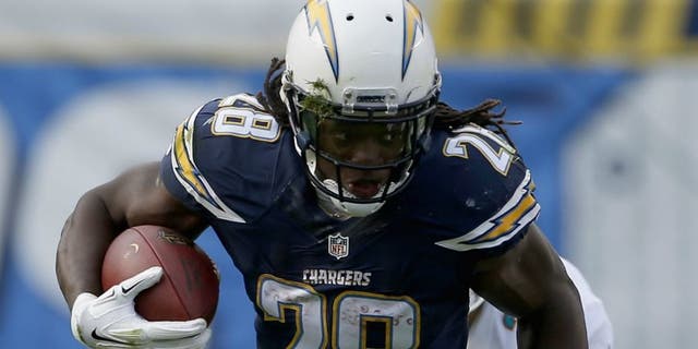 at Qualcomm Stadium on December 20, 2015 in San Diego, California.,SAN DIEGO, CA - DECEMBER 20: Melvin Gordon #28 of the San Diego Chargers runs against Bobby McCain #28 of the Miami Dolphins at Qualcomm Stadium on December 20, 2015 in San Diego, California. (Photo by Todd Warshaw/Getty Images)