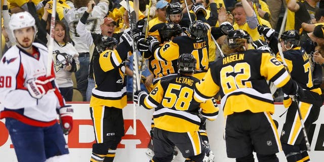 PITTSBURGH, PA - MAY 10: Nick Bonino #13 of the Pittsburgh Penguins celebrates his game winning overtime goal against the Washington Capitals in Game Six of the Eastern Conference Second Round during the 2016 NHL Stanley Cup Playoffs at Consol Energy Center on May 10, 2016 in Pittsburgh, Pennsylvania. (Photo by Justin K. Aller/Getty Images)