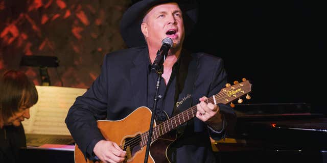 Nov. 17, 2014: Singer and songwriter Garth Brooks performs after accepting an award at the American Society of Composers, Authors and Publishers Centennial Awards in New York.