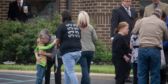 Mourners arrive at Dry Run Church of Christ for funeral services for six of the eight murder victims from Pike County, Tuesday, May 3, 2016, in West Portsmouth, Ohio.
