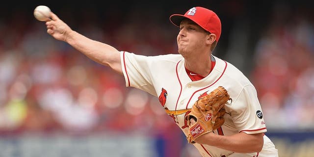 ST. LOUIS, MO - APRIL 18: Seth Maness #61 of the St. Louis Cardinals pitches against the Cincinnati Reds in the sixth inning at Busch Stadium on April 18, 2015 in St. Louis, Missouri. The Cardinals defeated the Reds 5-2. (Photo by Michael Thomas/Getty Images)