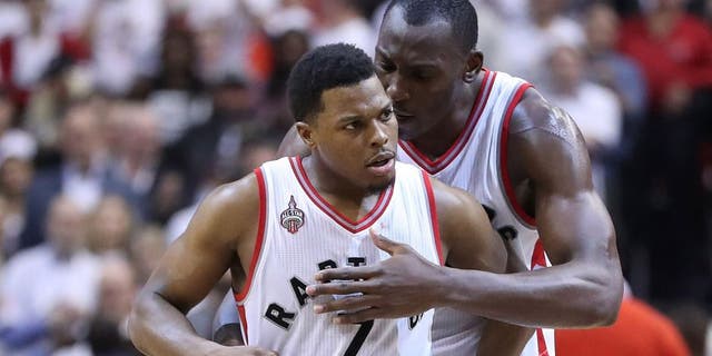 TORONTO, ON- MAY 11: Bismack Biyombo congratulates Kyle Lowry after he hit a key basket late in the game as the Toronto Raptors beat the Miami Heat in game five 99-91 of their Eastern Conference Semifinal at the Air Canada Centre in Toronto. May 11, 2016. (Steve Russell/Toronto Star via Getty Images)