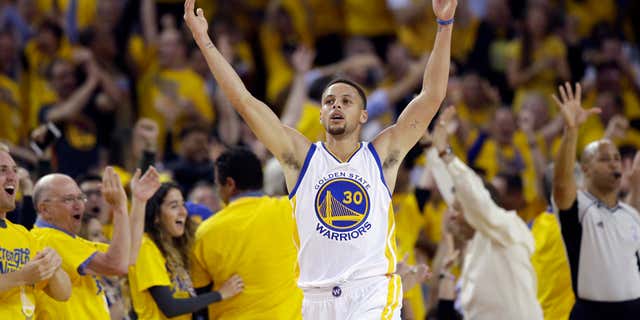 Golden State Warriors' Stephen Curry celebrates after scoring against the Portland Trail Blazers during the first half in Game 5 of a second-round NBA basketball playoff series Wednesday, May 11, 2016, in Oakland, Calif.