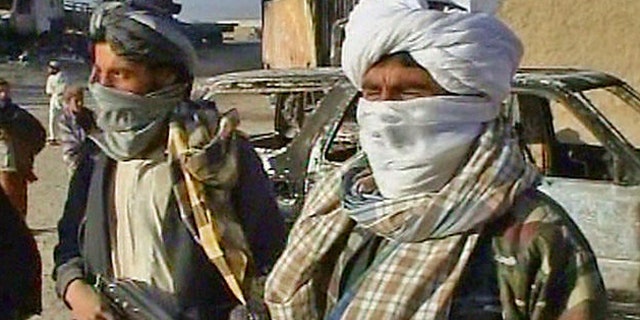 Oct. 20, 2009: Taliban militants are shown after they attacked a military convoy near Kabul, Afghanistan.