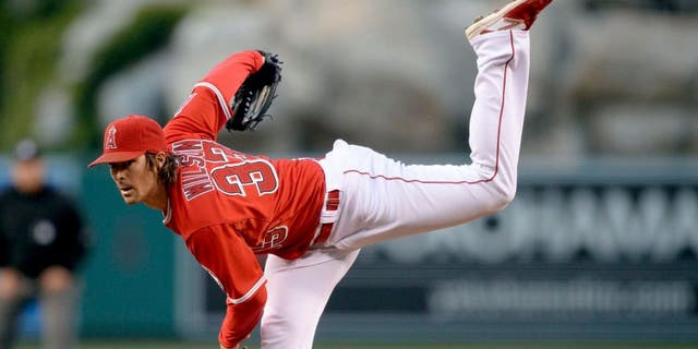 May 12, 2015; Anaheim, CA, USA; Los Angeles Angels starting pitcher C.J. Wilson (33) pitches against the Colorado Rockies during the second inning at Angel Stadium of Anaheim. Mandatory Credit: Kelvin Kuo-USA TODAY Sports