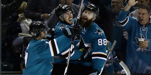 SAN JOSE, CA - MAY 12: Logan Couture #39 of the San Jose Sharks is congratulated by Brent Burns #88 and Joonas Donskoi #27 after Couture scored in the second period against the Nashville Predators in Game Seven of the Western Conference Second Round during the 2016 NHL Stanley Cup Playoffs at SAP Center on May 12, 2016 in San Jose, California. (Photo by Ezra Shaw/Getty Images)