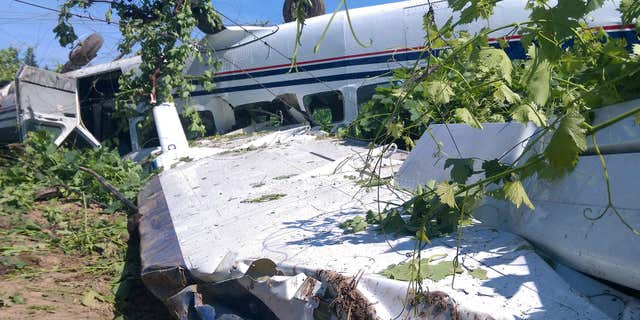 May 12, 2016: A single-engine Cessna Caravan from the Lodi Parachute Center sits flipped over after an emergency landing in a vineyard near a home in rural San Joaquin County near Lodi, Calif.