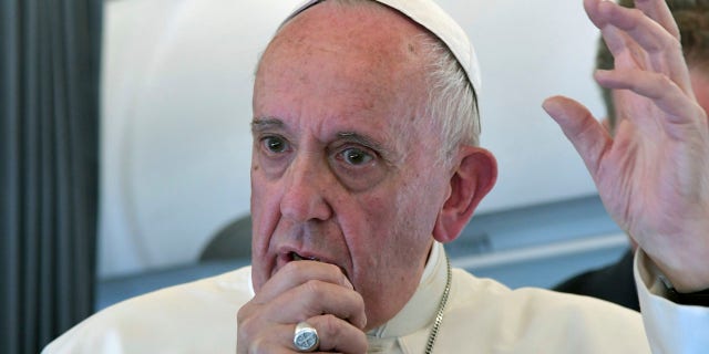 Pope Francis addresses journalists on his flight back to Rome following a two-day visit at Fatima, Portugal, May 13, 2017.