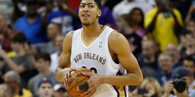 Mar 22, 2014; New Orleans, LA, USA; New Orleans Pelicans forward Anthony Davis (23) reacts as time expires during the fourth quarter of a win against the Miami Heat in a game at the Smoothie King Center. The Pelicans defeated the Heat 105-95. Mandatory Credit: Derick E. Hingle-USA TODAY Sports