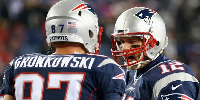 &gt; of the New England Patriots of the Buffalo Bills at Gillette Stadium on November 23, 2015 in Foxboro, Massachusetts.,FOXBORO, MA - NOVEMBER 23: Tom Brady #12 of the New England Patriots reacts with Rob Gronkowski #87 before a game against the Buffalo Bills at Gillette Stadium on November 23, 2015 in Foxboro, Massachusetts. (Photo by Jim Rogash/Getty Images)