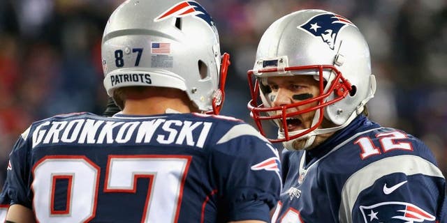 > of the New England Patriots of the Buffalo Bills at Gillette Stadium on November 23, 2015 in Foxboro, Massachusetts.,FOXBORO, MA - NOVEMBER 23: Tom Brady #12 of the New England Patriots reacts with Rob Gronkowski #87 before a game against the Buffalo Bills at Gillette Stadium on November 23, 2015 in Foxboro, Massachusetts. (Photo by Jim Rogash/Getty Images)