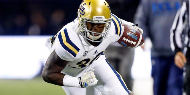 Nov 8, 2014; Seattle, WA, USA; UCLA Bruins running back Myles Jack (30) rushes for a 28-yard touchdown against the Washington Huskies during the second quarter at Husky Stadium. Mandatory Credit: Joe Nicholson-USA TODAY Sports