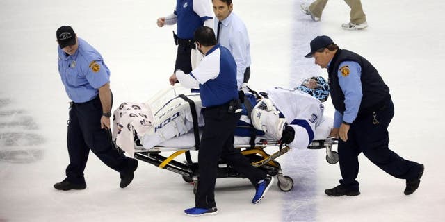 May 13, 2016; Pittsburgh, PA, USA; Tampa Bay Lightning goalie Ben Bishop (30) is taken from the ice on a stretcher after suffering an apparent injury against the Pittsburgh Penguins during the first period in game one of the Eastern Conference Final of the 2016 Stanley Cup Playoffs at the CONSOL Energy Center. Mandatory Credit: Charles LeClaire-USA TODAY Sports