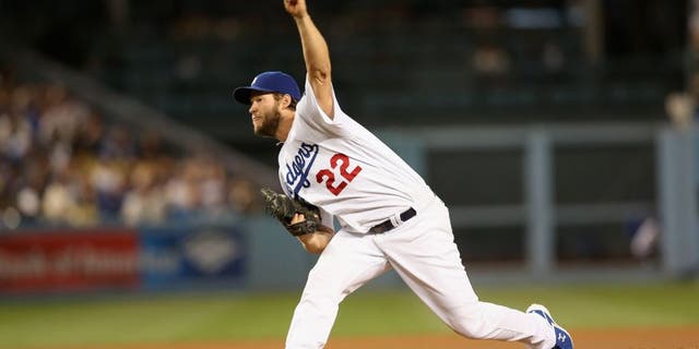 LOS ANGELES, CALIFORNIA - MAY 12: Clayton Kershaw #22 of the Los Angeles Dodgers throws a pitch against the New York Mets at Dodger Stadium on May 12, 2016 in Los Angeles, California. Kershaw threw a complete game shutout with 13 strikeouts as the Dodgers won 5-0. (Photo by Stephen Dunn/Getty Images)