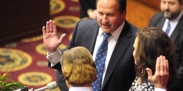 Jan. 7, 2015: In this file photo, John J. Diehl Jr., center, is sworn in as the Speaker Pro Tem of the House of Representatives during the opening of the Missouri legislature in Jefferson City, Mo.