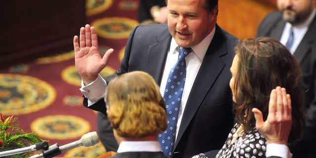 Jan. 7, 2015: In this file photo, John J. Diehl Jr., center, is sworn in as the Speaker Pro Tem of the House of Representatives during the opening of the Missouri legislature in Jefferson City, Mo.