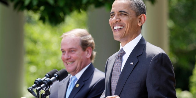 May 12: President Barack Obama, accompanied by National Association of Police Organizations (NAOP) President Thomas J. Nee, speaks in the Rose Garden of the White House during a ceremony to honor the NAOP, TOP COPS.