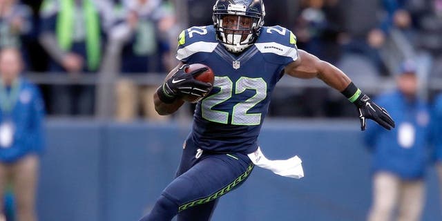 SEATTLE, WA - DECEMBER 28: Running back Robert Turbin #22 of the Seattle Seahawks runs with the ball during the second quarter of the game against the St. Louis Rams at CenturyLink Field on December 28, 2014 in Seattle, Washington. (Photo by Otto Greule Jr/Getty Images)