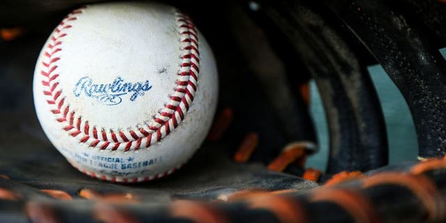 A baseball sits inside a glove before a spring training game between the Miami Marlins and New York Mets on March 15, 2016, in Jupiter, Fla. (Getty Images)