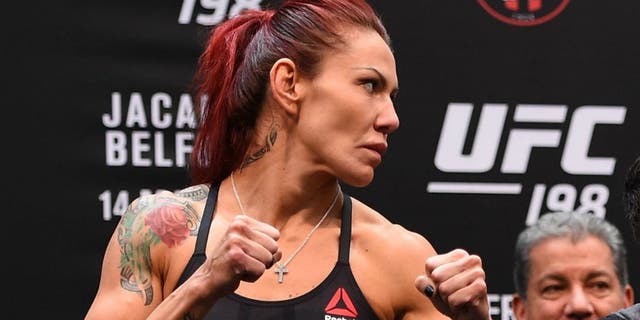 CURITIBA, BRAZIL - MAY 13: (L-R) Opponents Cristiane 'Cyborg' Justino of Brazil and Leslie Smith face off during the UFC 198 weigh-in at Arena da Baixada stadium on May 13, 2016 in Curitiba, Parana, Brazil. (Photo by Josh Hedges/Zuffa LLC/Zuffa LLC via Getty Images)