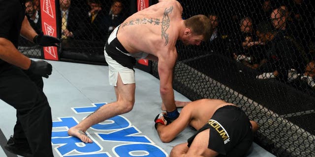 CURITIBA, BRAZIL - MAY 14: (L-R) Stipe Miocic punches Fabricio Werdum of Brazil in their UFC heavyweight championship bout during the UFC 198 event at Arena da Baixada stadium on May 14, 2016 in Curitiba, Parana, Brazil. (Photo by Josh Hedges/Zuffa LLC/Zuffa LLC via Getty Images)