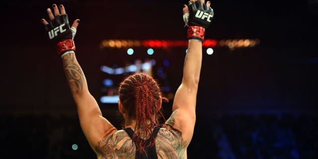 CURITIBA, BRAZIL - MAY 14: Cristiane 'Cyborg' Justino of Brazil celebrates after defeating Leslie Smith in their women's catchweight bout during the UFC 198 event at Arena da Baixada stadium on May 14, 2016 in Curitiba, Parana, Brazil. (Photo by Josh Hedges/Zuffa LLC/Zuffa LLC via Getty Images)