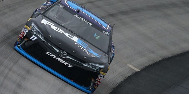DOVER, DE - MAY 13: Denny Hamlin, driver of the #11 FedEx Office Toyota, practices for the NASCAR Sprint Cup Series AAA 400 Drive For Autism at Dover International Speedway on May 13, 2016 in Dover, Delaware. (Photo by Sean Gardner/Getty Images)
