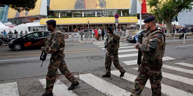 May 11, 2016: French soldiers patrol in front of the Festival Palace before the opening of the 69th Cannes Film Festival in Cannes, France.