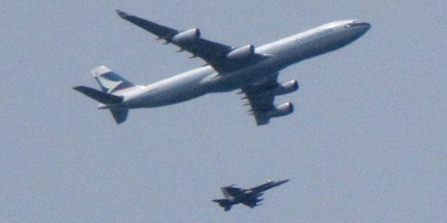 May 15: An F-18 Hornet fighter jet intercepts a Cathay Pacific passenger plane headed for Vancouver, Canada.