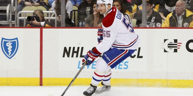 Jan 3, 2015; Pittsburgh, PA, USA; Montreal Canadiens defensemen Sergei Gonchar (55) handles the puck against the Pittsburgh Penguins during the first period at the Consol Energy Center. Canadiens defeated the Penguins 4-1. Mandatory Credit: Matthew O'Haren-USA TODAY Sports