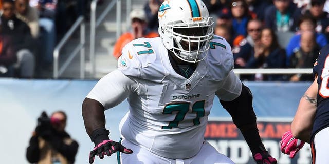 Oct 19, 2014; Chicago, IL, USA; Miami Dolphins tackle Branden Albert (71) during the second half at Soldier Field. Miami Dolphins defeat the Chicago Bears 27-14. Mandatory Credit: Mike DiNovo-USA TODAY Sports