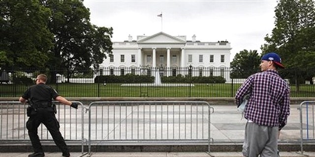 May 2: Sidewalk in front of the White House in Washington is reopened.