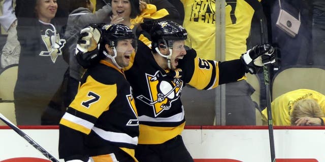 PITTSBURGH, PA - MAY 16: Sidney Crosby #87 of the Pittsburgh Penguins celebrates with teammate Matt Cullen #7 after scoring a goal in overtime against Andrei Vasilevskiy #88 of the Tampa Bay Lightning to win Game Two of the Eastern Conference Final with a score of 3 to 2 during the 2016 NHL Stanley Cup Playoffs at the Consol Energy Center on May 16, 2016 in Pittsburgh, Pennsylvania. (Photo by Bruce Bennett/Getty Images)