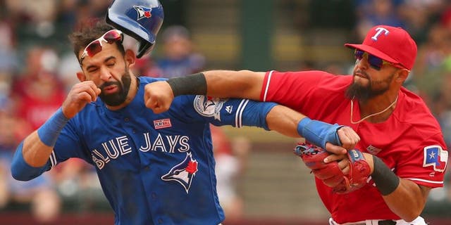 Toronto Blue Jays Jose Bautista (19) gets hit by Texas Rangers second baseman Rougned Odor (12) after Bautista slid into second in the 8th inning at Globe Life Park on May 15, 2016 in Arlington, Texas. The Rangers won 7-6. (Richard W. Rodriguez/Fort Worth Star-Telegram/TNS),Toronto Blue Jays Jose Bautista (19) gets hit by Texas Rangers second baseman Rougned Odor (12) after Bautista slid into second in the 8th inning at Globe Life Park on May 15, 2016 in Arlington, Texas. The Rangers won 7-6. (Richard W. Rodriguez/Fort Worth Star-Telegram/TNS via Getty Images)