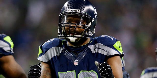 during the 2014 NFC Championship at CenturyLink Field on January 19, 2014 in Seattle, Washington.,SEATTLE, WA - JANUARY 19: Defensive end Michael Bennett #72 of the Seattle Seahawks and defensive tackle Clinton McDonald #69 react against the San Francisco 49ers during the 2014 NFC Championship at CenturyLink Field on January 19, 2014 in Seattle, Washington. (Photo by Ronald Martinez/Getty Images)