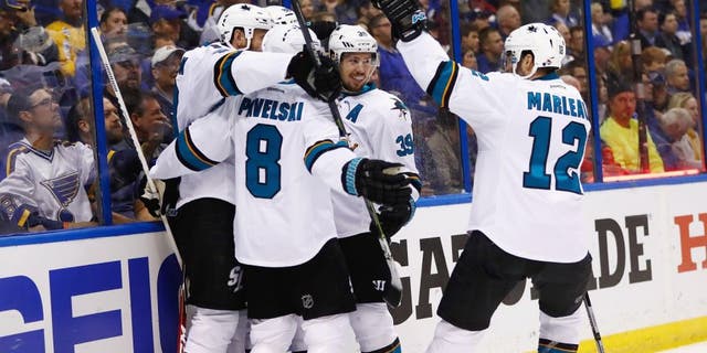 ST LOUIS, MO - MAY 17: Brent Burns #88 of the San Jose Sharks celebrates with Joe Thornton #19, Joe Pavelski #8, Logan Couture #39, and Patrick Marleau #12 after scoring a second period goal against Brian Elliott #1 of the St. Louis Blues in Game Two of the Western Conference Final during the 2016 NHL Stanley Cup Playoffs at Scottrade Center on May 17, 2016 in St Louis, Missouri. (Photo by Jamie Squire/Getty Images)