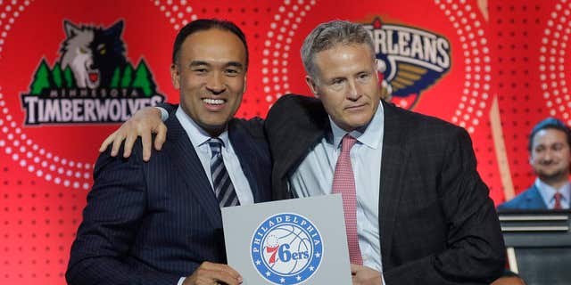 NBA deputy commissioner Mark Tatum, left, poses for a photo with Philadelphia 76ers head coach Brett Brown during the NBA basketball draft lottery, Tuesday, May 17, 2016, in New York.
