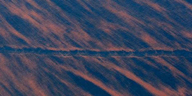 May 17: A ship's wake cuts through a pattern of oil near the site of the Deepwater Horizon oil spill in the Gulf of Mexico.