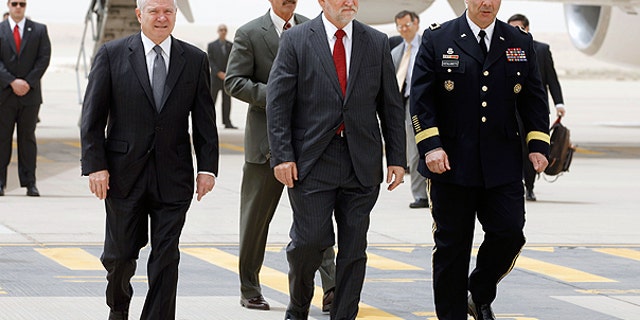April 6: Defense Secretary Robert Gates, left, U.S. Ambassador to Saudi Arabia James Smith, center, and Maj. Gen. Robert Catalanotti, right, walk across the tarmac in Riyadh, Saudi Arabia.