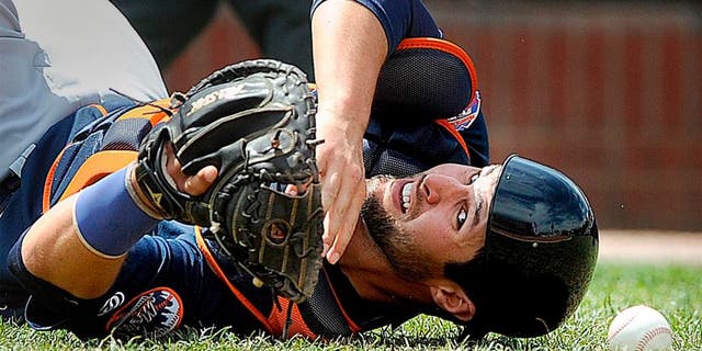 PORTLAND, ME - MAY 14: Colton Plaia of the Binghamton Mets looks back for the baseball after falling to the ground and failing to make a catch on a pop up behind home plate Saturday, May 14, 2016. (Photo by Gabe Souza/Portland Press Herald via Getty Images)