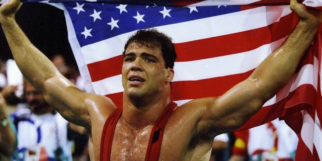 31 Jul 1996: Kurt Angle of the United States holds the American flag at the free-style wrestling competition during the Summer Olympics at the Georgia World Congress Center in Atlanta, Georgia.