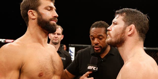 SYDNEY, NSW - NOVEMBER 08: (L-R) Opponents Luke Rockhold of the United States and Michael Bisping of England face off before their middleweight bout during the UFC Fight Night event inside Allphones Arena on November 8, 2014 in Sydney, Australia. (Photo by Josh Hedges/Zuffa LLC/Zuffa LLC via Getty Images)