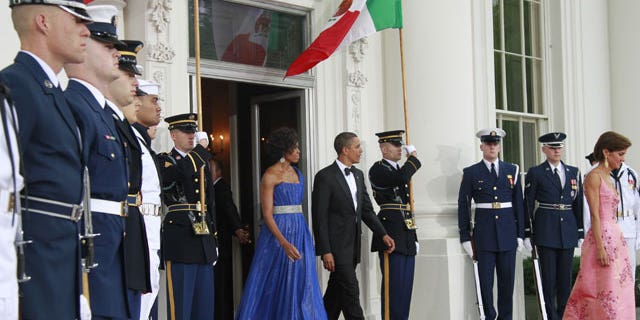 May 19: President Obama and first lady Michelle Obama walk out on the North Portico of the White House to welcome Mexican President Felipe Calderon and Mexico's first lady Margarita Zavala for the State Dinner at the White House in Washington.