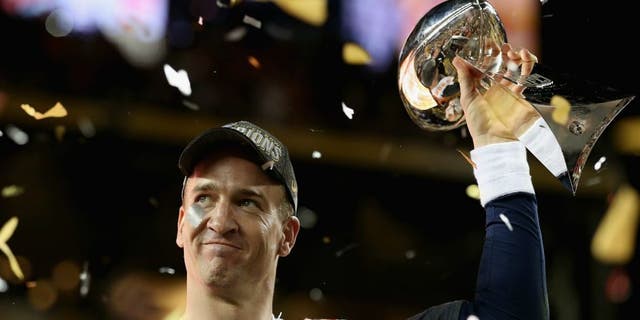 during Super Bowl 50 at Levi's Stadium on February 7, 2016 in Santa Clara, California.,SANTA CLARA, CA - FEBRUARY 07: Quarterback Peyton Manning #18 of the Denver Broncos holds the Vince Lombardi Trophy after winning Super Bowl 50 against the Carolina Panthers at Levi's Stadium on February 7, 2016 in Santa Clara, California. (Photo by Patrick Smith/Getty Images)