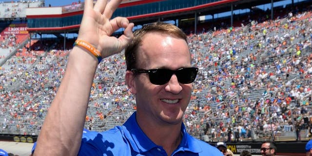 during the NASCAR Sprint Cup Series Food City 500 at Bristol Motor Speedway on April 17, 2016 in Bristol, Tennessee.,BRISTOL, TN - APRIL 17: Former NFL quarterback, Peyton Manning stands on the grid prior to the NASCAR Sprint Cup Series Food City 500 at Bristol Motor Speedway on April 17, 2016 in Bristol, Tennessee. (Photo by Robert Laberge/Getty Images)