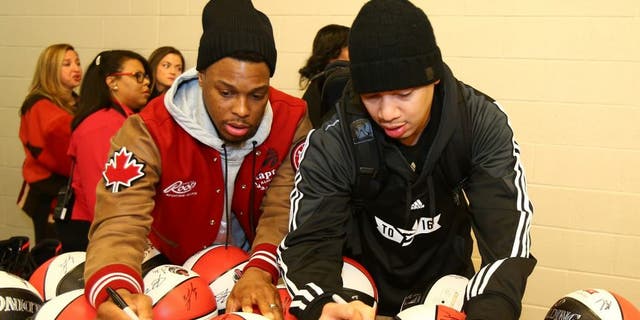 TORONTO, CANADA - FEBRUARY 13: Kyle Lowry #7 and Tyronn Lue of the Eastern Conference All-Stars autographs balls before the NBA All-Star Practice as part of 2016 All-Star Weekend at the Ricoh Coliseum on February 13, 2016 in Toronto, Ontario, Canada. NOTE TO USER: User expressly acknowledges and agrees that, by downloading and/or using this photograph, user is consenting to the terms and conditions of the Getty Images License Agreement. Mandatory Copyright Notice: Copyright 2016 NBAE (Photo by Nathaniel S. Butler/NBAE via Getty Images)