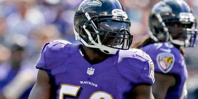 Sep 15, 2013; Baltimore, MD, USA; Baltimore Ravens linebacker Elvis Dumervil (58) during the game against the Cleveland Browns at M&T Bank Stadium. Mandatory Credit: Mitch Stringer-USA TODAY Sports