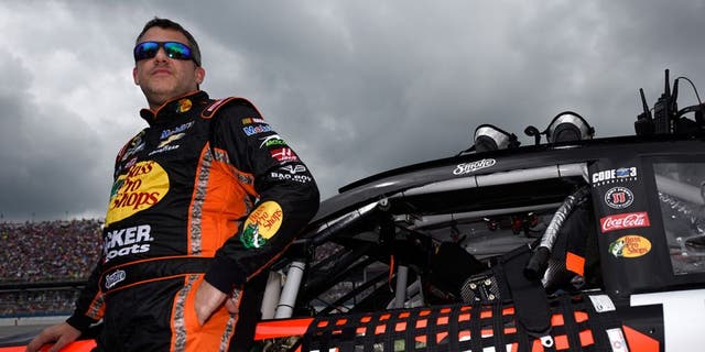 TALLADEGA, AL - MAY 01: Tony Stewart, driver of the #14 Bass Pro Shops Chevrolet, stands on the grid prior to the NASCAR Sprint Cup Series GEICO 500 at Talladega Superspeedway on May 1, 2016 in Talladega, Alabama. (Photo by Jared C. Tilton/Getty Images)